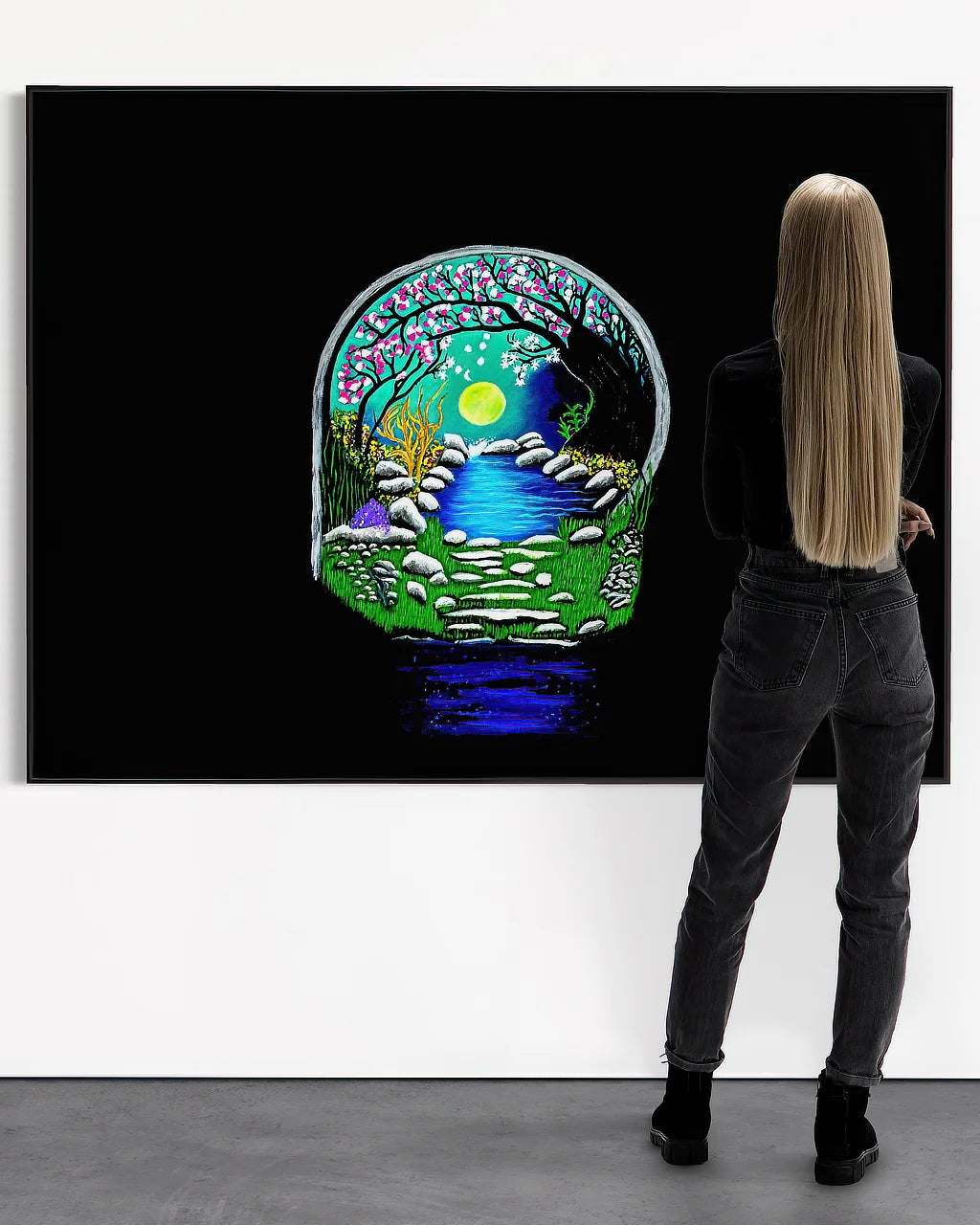 Olivia looking at The Secret Crossing BLACK Canvas Originals framed (54x72 inch), landscape statement art in gallery.